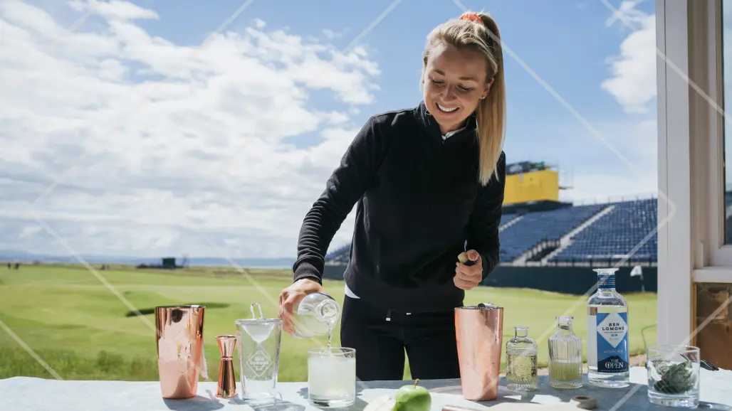 Hannah Davies serving up "The Game Changer" cocktail made with Ben Lomond Gin, showcasing her signature serve.